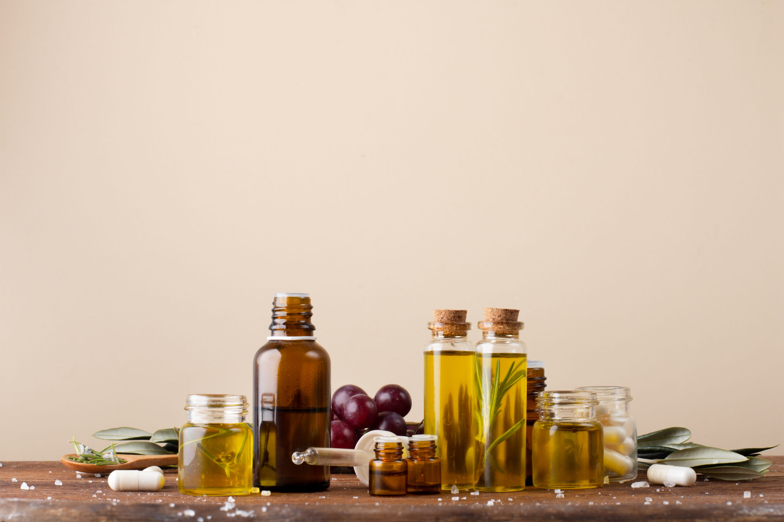 front-view-plastic-bottles-with-oil-medicine-table